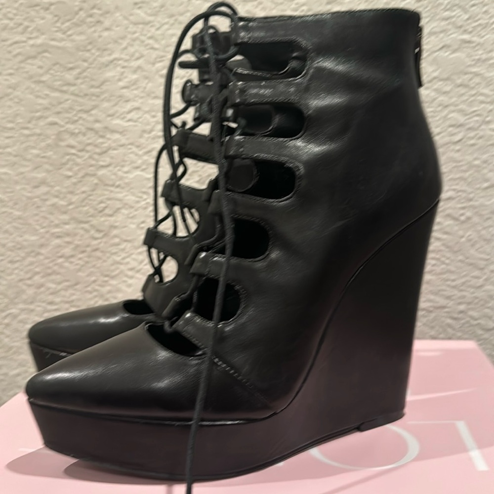 BCBGeneration Black leather wedge heel booties